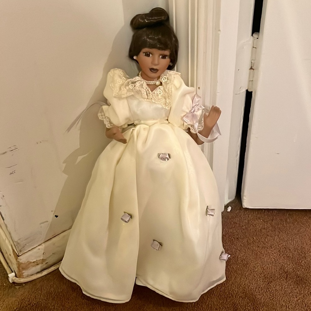 Black Yvonne porcelain doll with baby